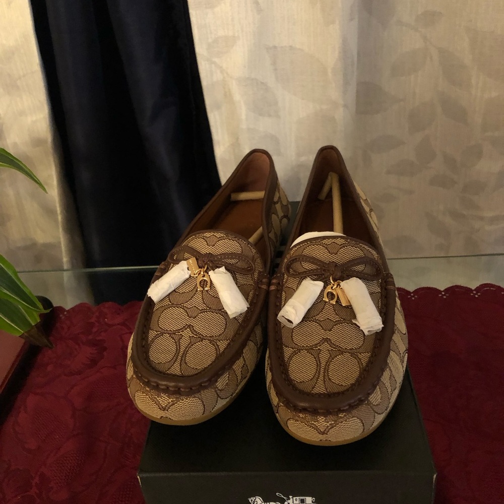 For sale  new authentic Coach loafers Brown/Khaki colors size 8.5 wide width.